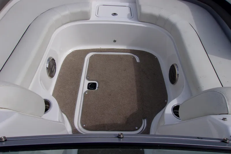 Slide: The Image of 2014 Hurricane Sundeck 217 IO boat interior with carpeted floor and seating. - 12