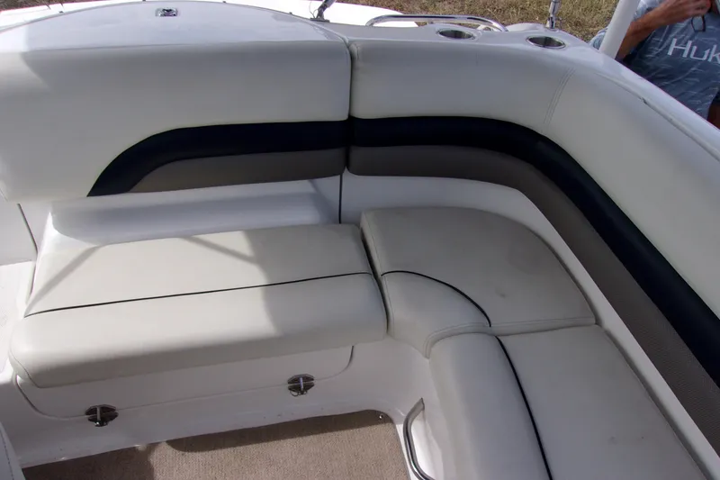 Slide: The Image of 2014 Hurricane Sundeck 217 IO boat interior seating with white and dark accents. - 7
