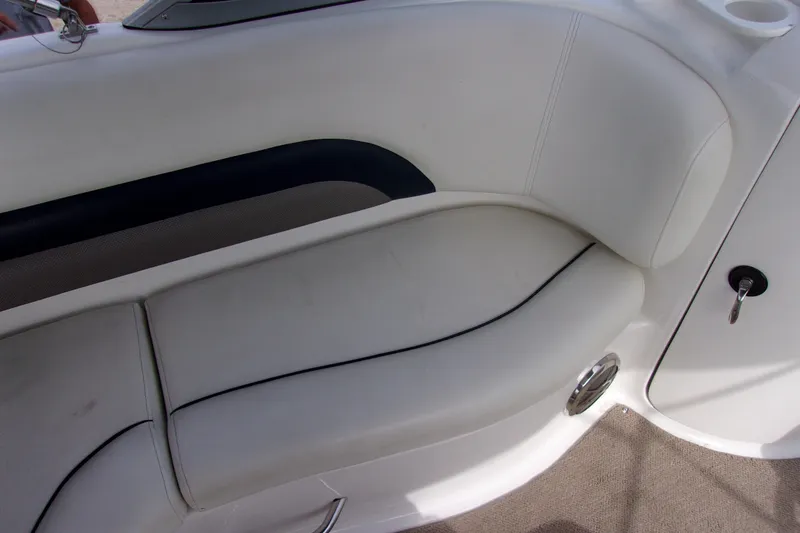 Slide: The Image of 2014 Hurricane Sundeck 217 IO boat interior seating with white upholstery. - 9