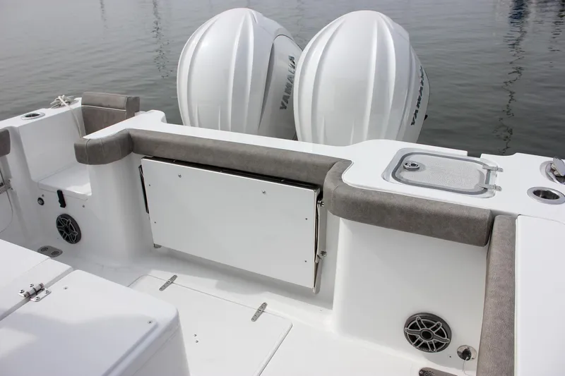 Slide: The Image of 2026 Sea Hunt Gamefish 28 boat interior with dual engines and seating. - 10