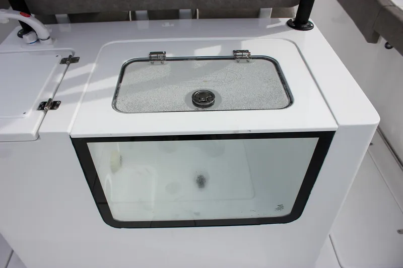 Slide: The Image of Livewell on 2026 Sea Hunt Gamefish 28 Forward Seating boat, featuring a transparent lid. - 15