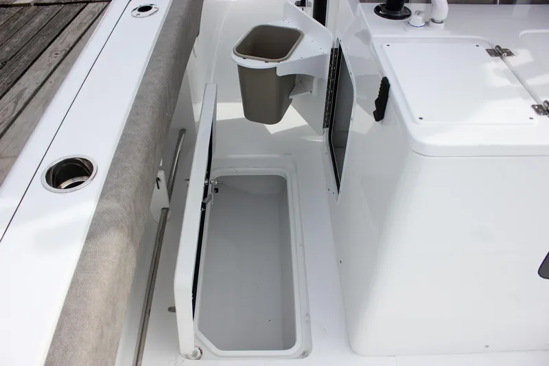 Slide: The Image of 2026 Sea Hunt Gamefish 28 boat interior with storage compartment and seating. - 18