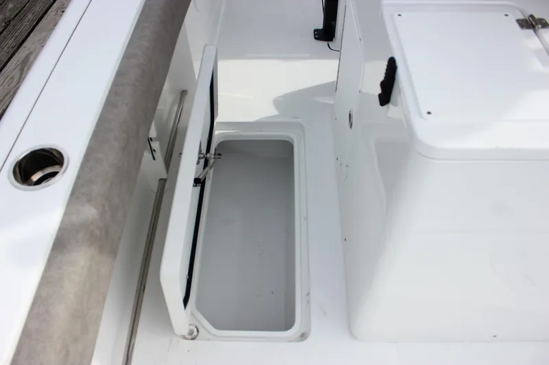 Slide: The Image of 2026 Sea Hunt Gamefish 28 Forward Seating boat storage compartment, open and ready for use. - 21