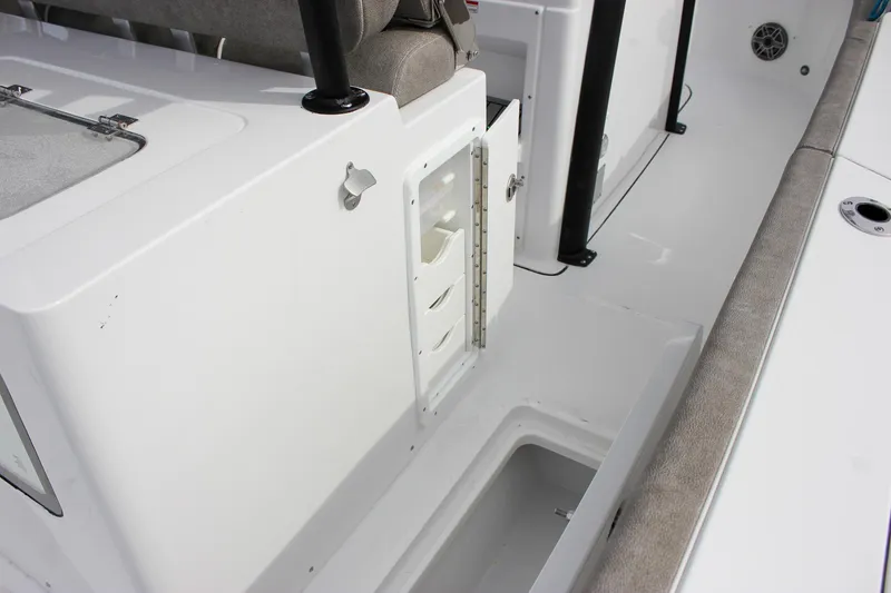 Slide: The Image of 2026 Sea Hunt Gamefish 28 Forward Seating boat interior with storage compartments. - 23