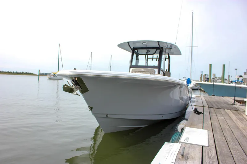 Slide: The Image of 2026 Sea Hunt Gamefish 28 Forward Seating boat docked at marina. - 3