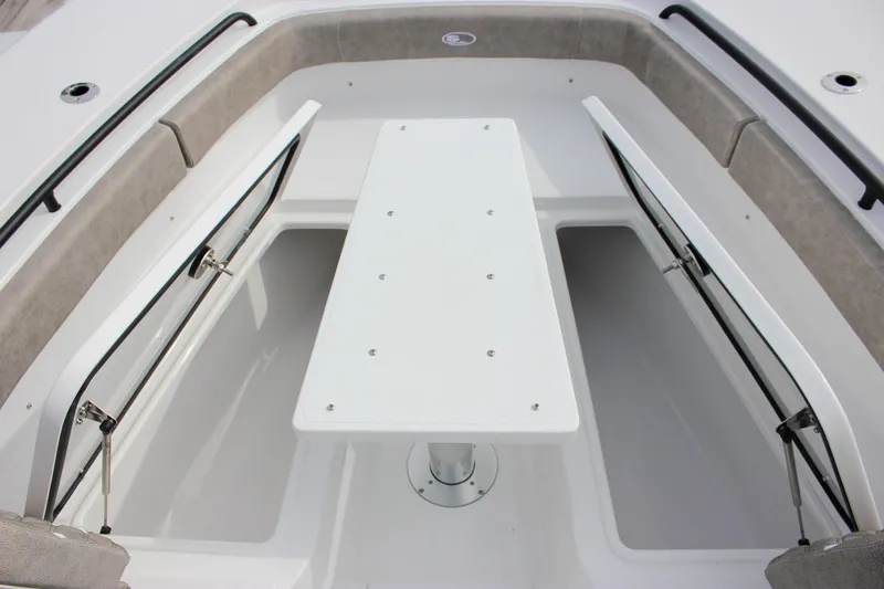 Slide: The Image of 2026 Sea Hunt Gamefish 28 Forward Seating with open storage compartments and center table. - 34