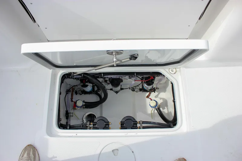 Slide: The Image of Open hatch of 2026 Sea Hunt Gamefish 28, revealing internal components and wiring. - 38