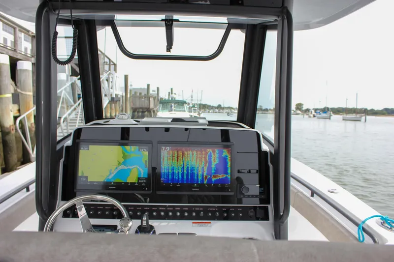 Slide: The Image of Helm of 2026 Sea Hunt Gamefish 28 with advanced navigation displays. - 5