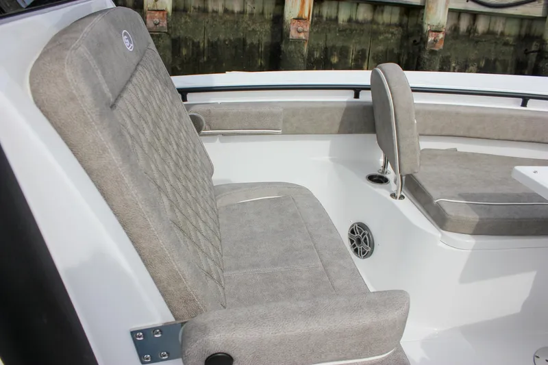 Slide: The Image of 2026 Sea Hunt Gamefish 28 Forward Seating with gray cushioned seats and speaker detail. - 50