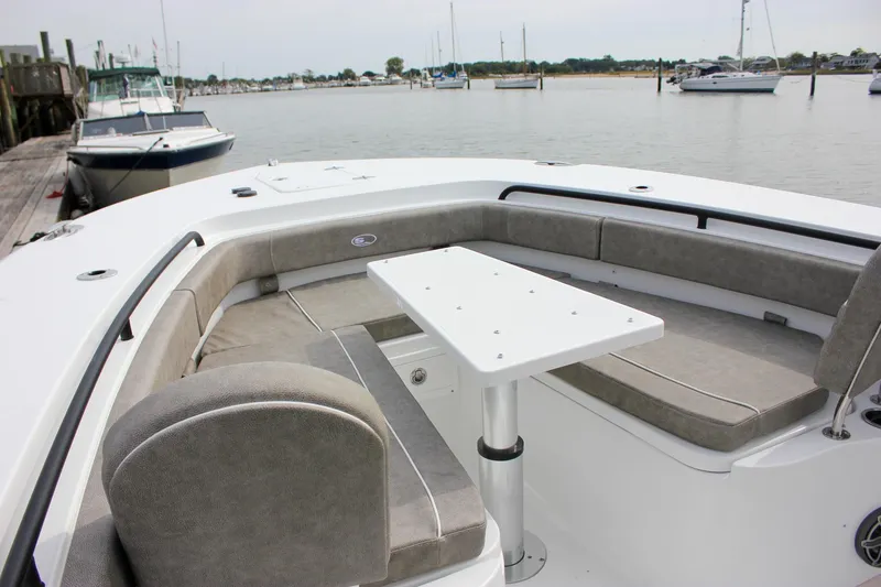 Slide: The Image of 2026 Sea Hunt Gamefish 28 Forward Seating with table, docked in a marina. - 51