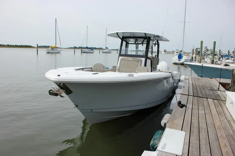 Slide: The Image of 2026 Sea Hunt Gamefish 28 Forward Seating boat docked at marina. - 8