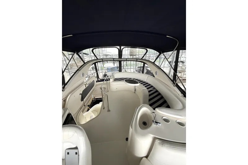 Slide: The Image of 2008 Meridian 391 yacht interior with seating and helm, featuring sleek design and modern amenities. - 10