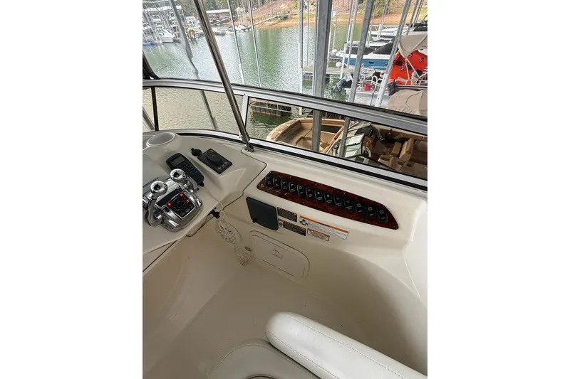 Slide: The Image of 2008 Meridian 391 yacht helm with controls and marina view. - 12