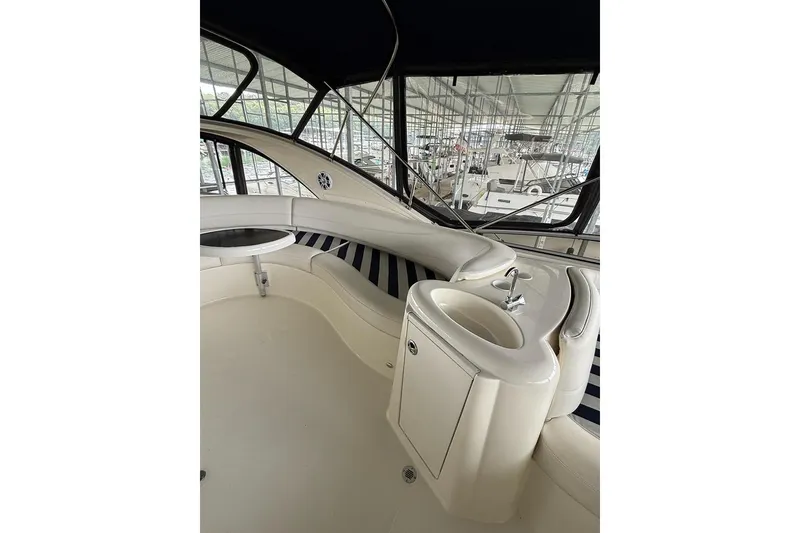 Slide: The Image of 2008 Meridian 391 yacht interior with seating and sink, featuring sleek design and modern amenities. - 15