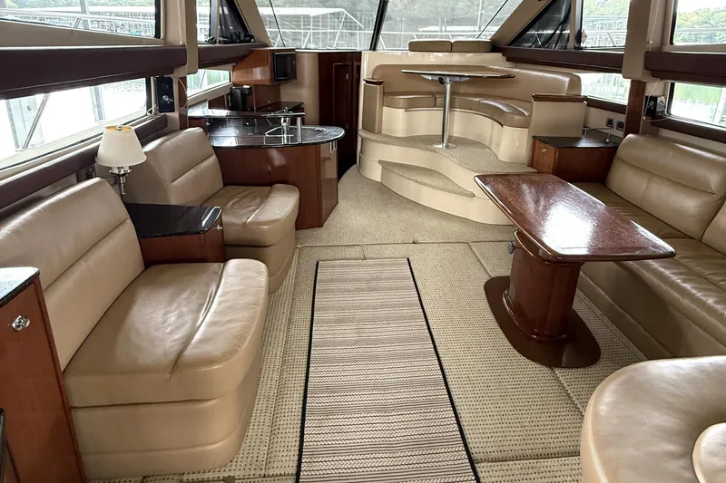 Slide: The Image of Luxurious interior of a 2008 Meridian 391 yacht with leather seating and elegant wood finishes. - 17