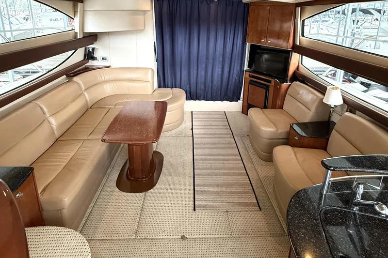 Slide: The Image of Luxurious interior of a 2008 Meridian 391 yacht with beige leather seating and wooden accents. - 18