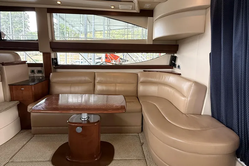 Slide: The Image of Luxurious interior of 2008 Meridian 391 yacht with leather seating and wooden table. - 21