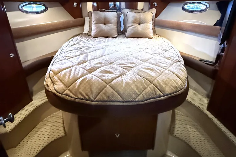 Slide: The Image of Luxurious 2008 Meridian 391 yacht bedroom with plush bedding and elegant design. - 27