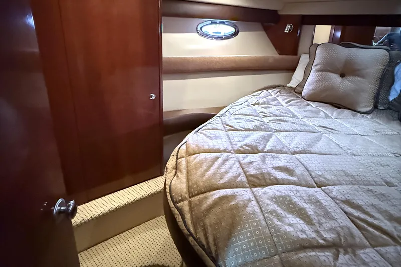 Slide: The Image of Luxurious cabin interior of 2008 Meridian 391 yacht with plush bedding and wood accents. - 28