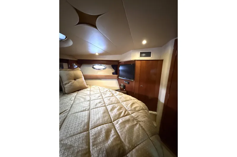 Slide: The Image of Luxurious interior of 2008 Meridian 391 yacht with cozy bedding and modern amenities. - 29