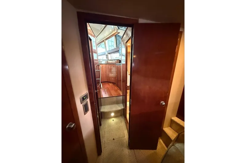 Slide: The Image of Interior view of 2008 Meridian 391 yacht, featuring wooden cabinetry and carpeted steps. - 30