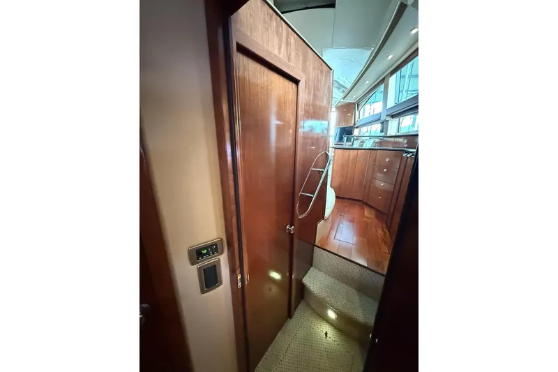 Slide: The Image of Interior view of 2008 Meridian 391 yacht with wooden cabinetry and carpeted steps. - 33