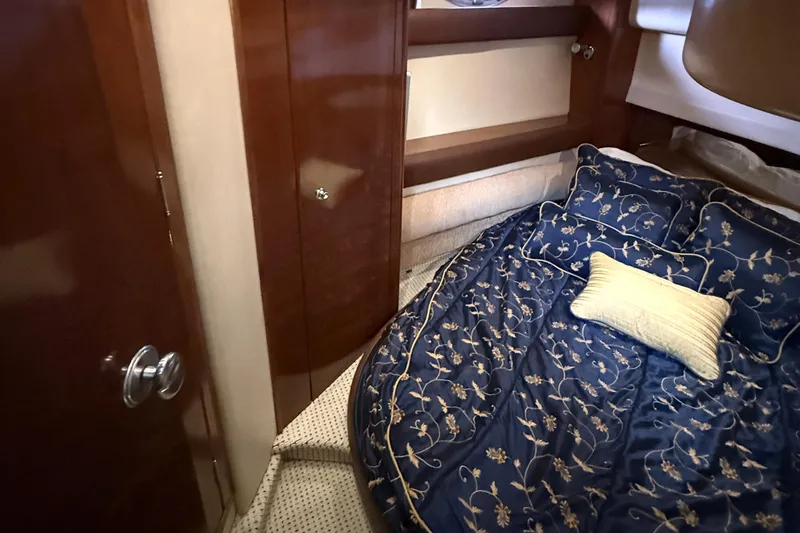 Slide: The Image of Luxurious 2008 Meridian 391 yacht cabin with elegant bedding and wooden cabinetry. - 35