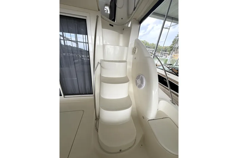 Slide: The Image of Staircase on 2008 Meridian 391 yacht, featuring sleek white design and outdoor view. - 42