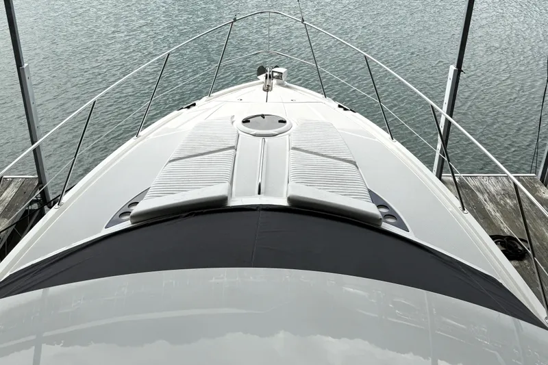 Slide: The Image of 2008 Meridian 391 yacht bow view, docked on calm water. - 44