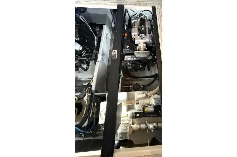 Slide: The Image of Engine compartment of a 2008 Meridian 391 boat, showcasing mechanical components. - 48