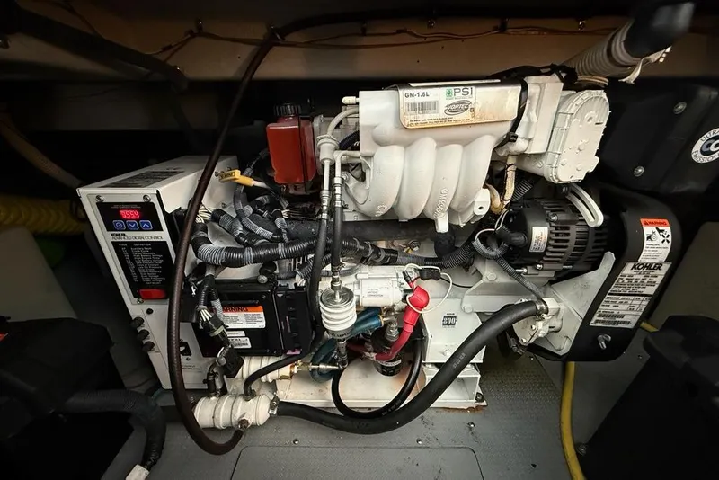 Slide: The Image of Engine compartment of a 2008 Meridian 391 boat, featuring complex wiring and components. - 51