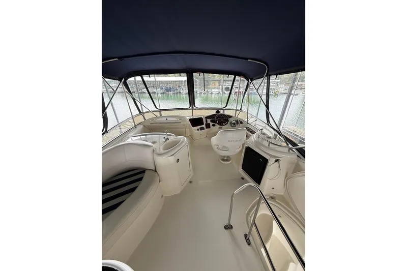 Slide: The Image of Interior view of 2008 Meridian 391 yacht with helm and seating area. - 9