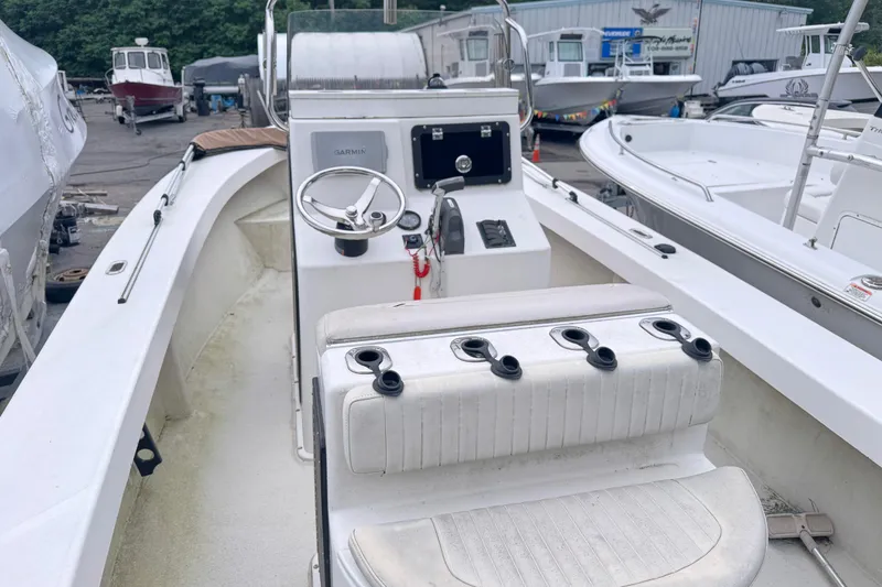 Slide: The Image of 2017 May-Craft 20 Cape Classic boat interior with steering wheel and seating. - 3