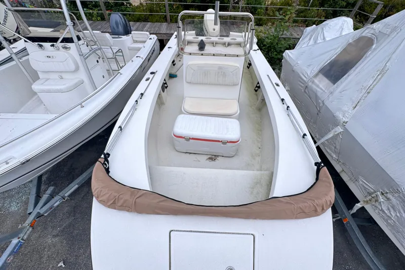 Slide: The Image of 2017 May-Craft 20 Cape Classic boat, white interior, docked alongside other boats. - 5