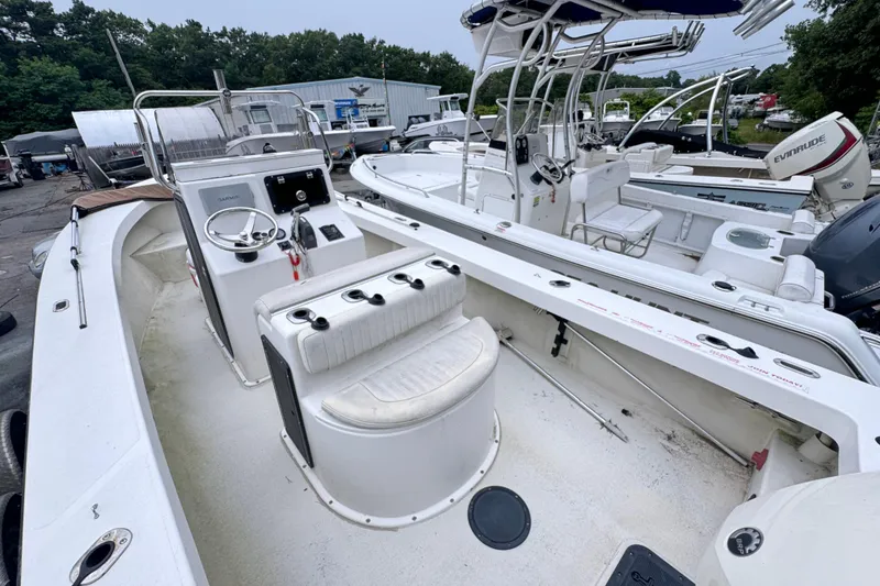 Slide: The Image of 2017 May-Craft 20 Cape Classic boat with center console and seating, docked outdoors. - 8