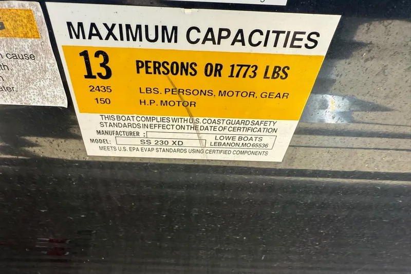 Slide: The Image of 2015 Lowe SS 230 capacity label: 13 persons or 1773 lbs, 150 HP motor. - 15