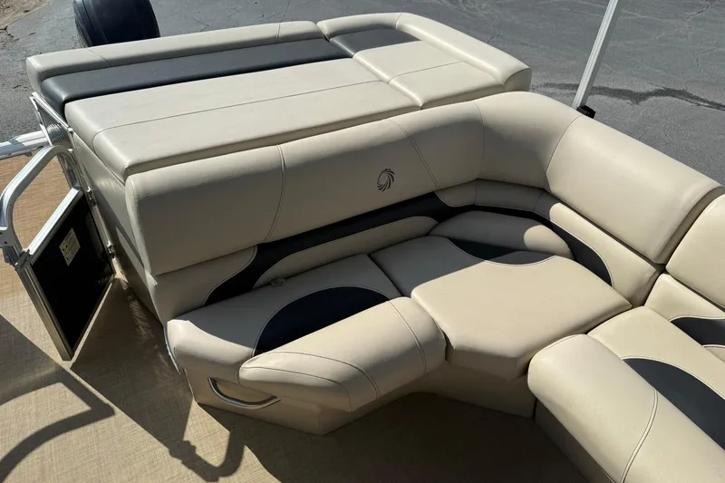 Slide: The Image of 2015 Lowe SS 230 boat interior with beige cushioned seating. - 16