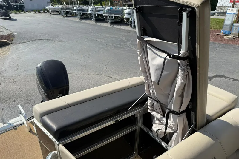 Slide: The Image of 2015 Lowe SS 230 boat with folded canopy and Mercury outboard motor. - 17