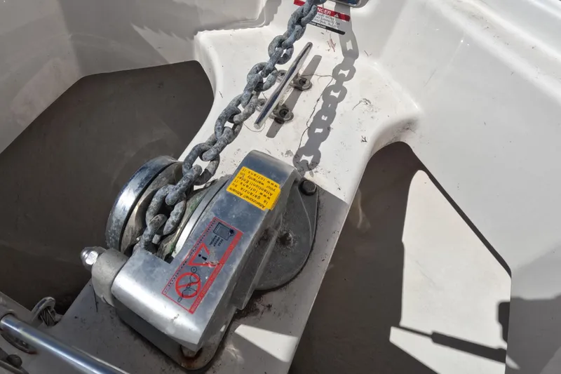 Slide: The Image of 2012 Robalo R247 Dual Console boat bathroom with sink and toilet. - 101