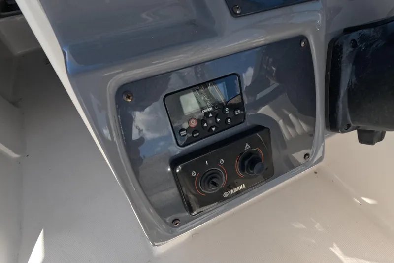 Slide: The Image of Control panel of 2012 Robalo R247 Dual Console boat with Yamaha controls. - 28