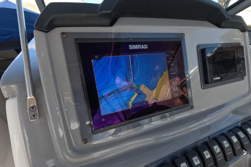 Slide: The Image of Simrad navigation display on 2012 Robalo R247 Dual Console boat dashboard. - 29