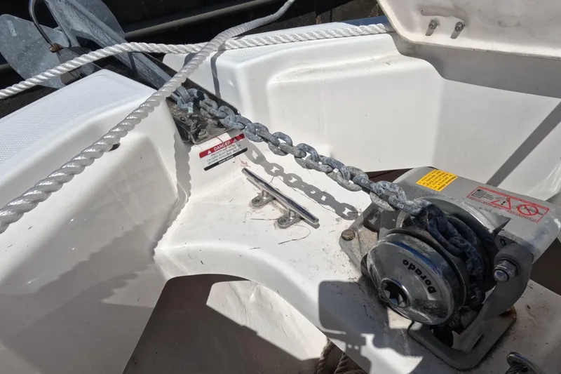 Slide: The Image of Anchor winch and chain on 2012 Robalo R247 Dual Console boat. - 3