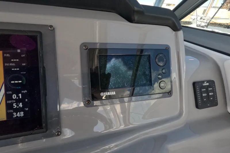 Slide: The Image of Dashboard of 2012 Robalo R247 Dual Console with Yamaha display and controls. - 30