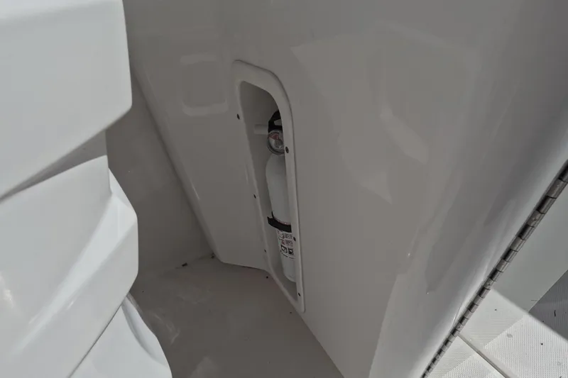 Slide: The Image of 2012 Robalo R247 Dual Console boat interior with mounted fire extinguisher. - 35