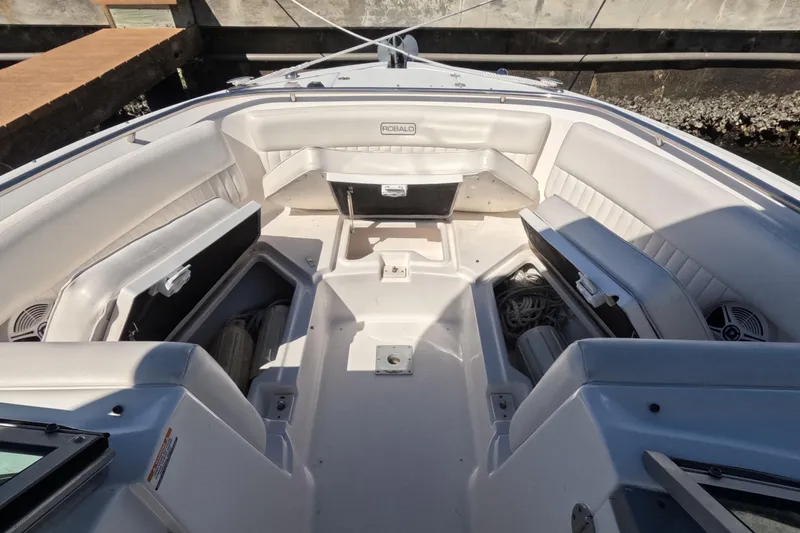 Slide: The Image of 2012 Robalo R247 Dual Console boat interior with spacious seating and storage compartments. - 51