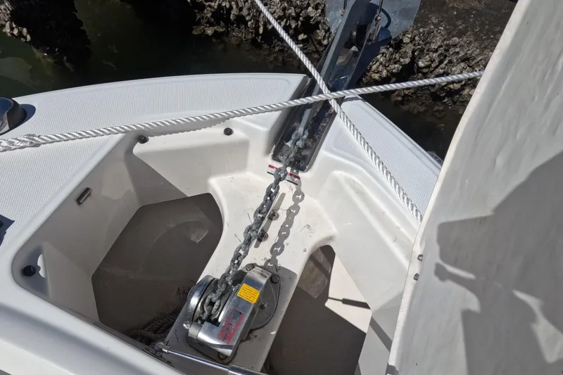 Slide: The Image of 2012 Robalo R247 Dual Console anchor system with chain and rope. - 58
