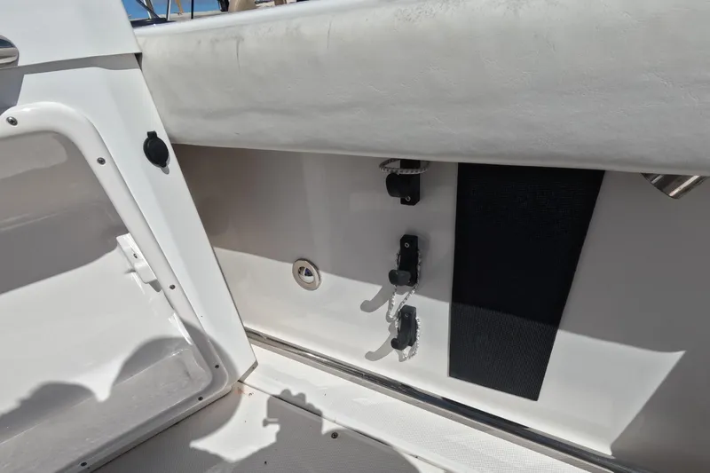 Slide: The Image of 2012 Robalo R247 Dual Console interior detail with storage and fixtures. - 68