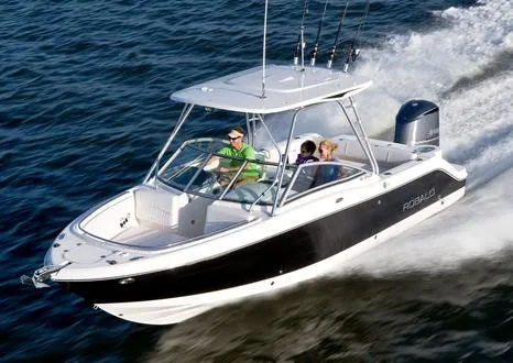 Slide: The Image of Manufacturer Provided Image: 2012 Robalo R247 Dual Console boat cruising on water. - 7