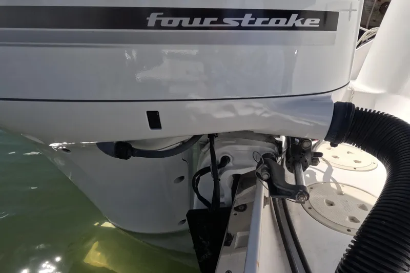 Slide: The Image of 2012 Robalo R247 Dual Console boat with four-stroke engine detail. - 71