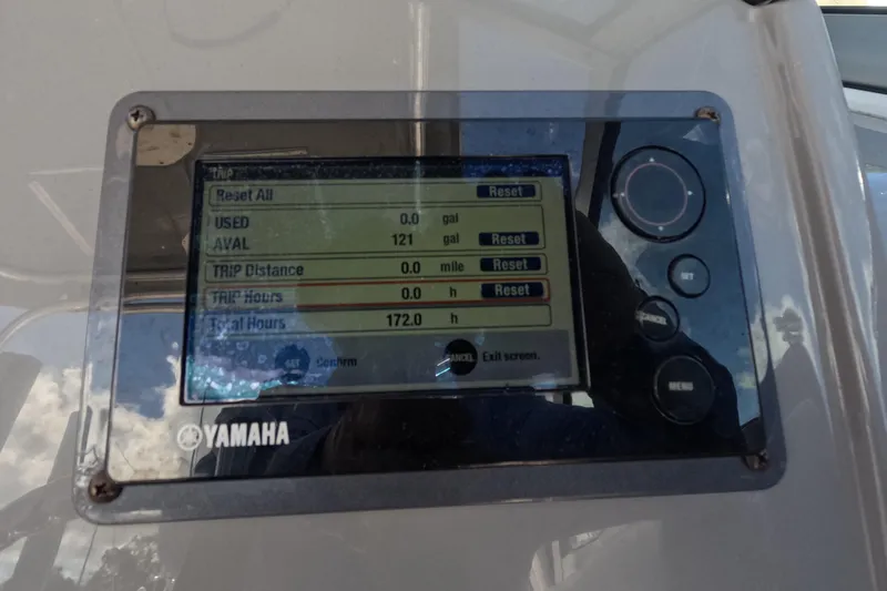 Slide: The Image of 2012 Robalo R247 Dual Console dashboard with Yamaha display and Lenco controls. - 91
